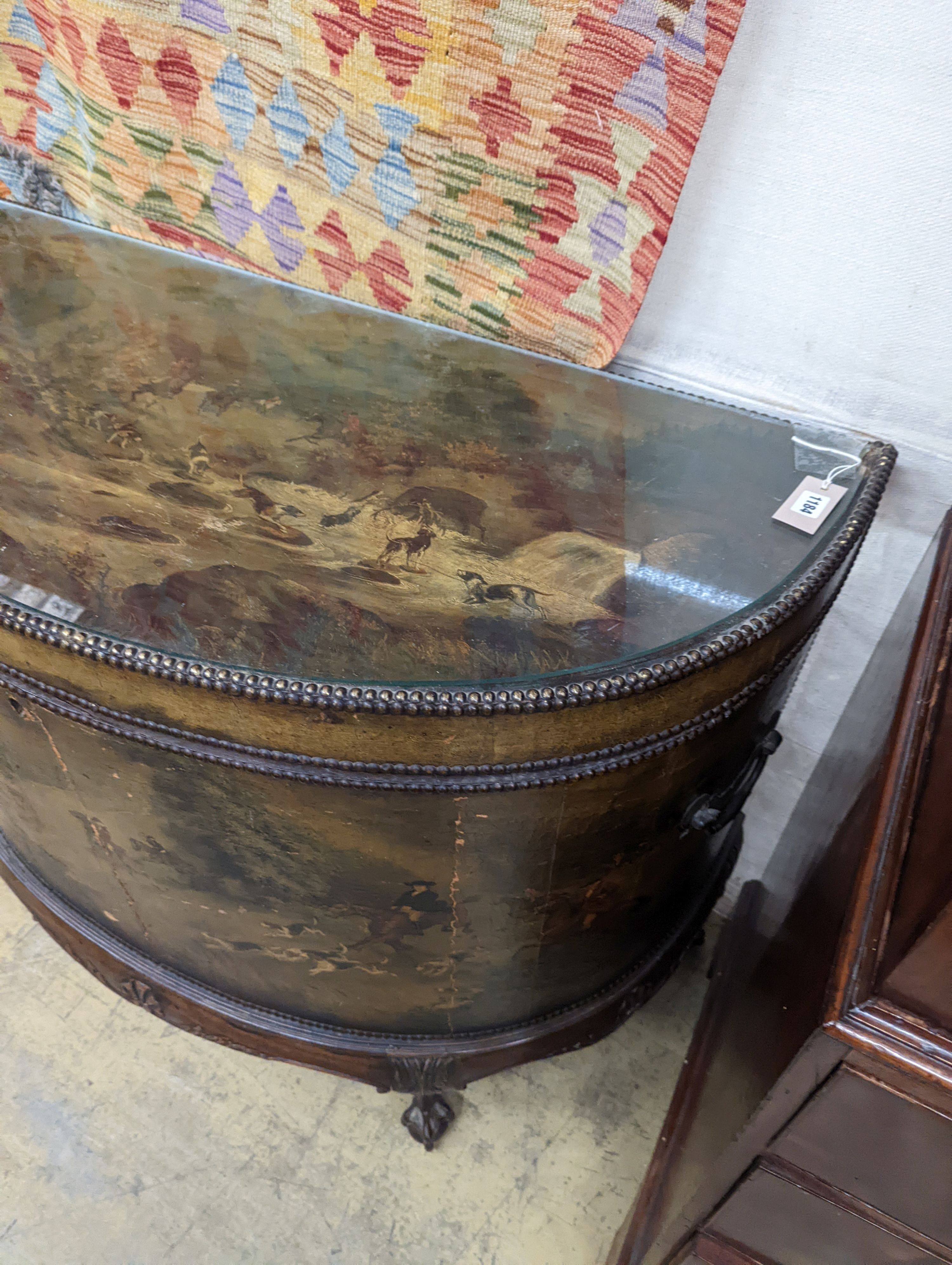 An early 20th century leather covered mahogany D shaped hinged top coffer painted with hunting scenes, length 114cm, depth 53cm, height 91cm